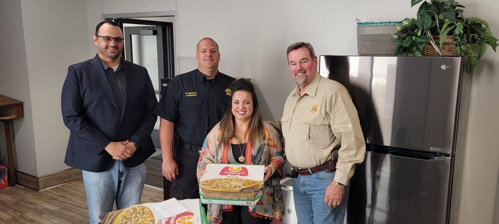 Edward Jones serves pizza for lunch