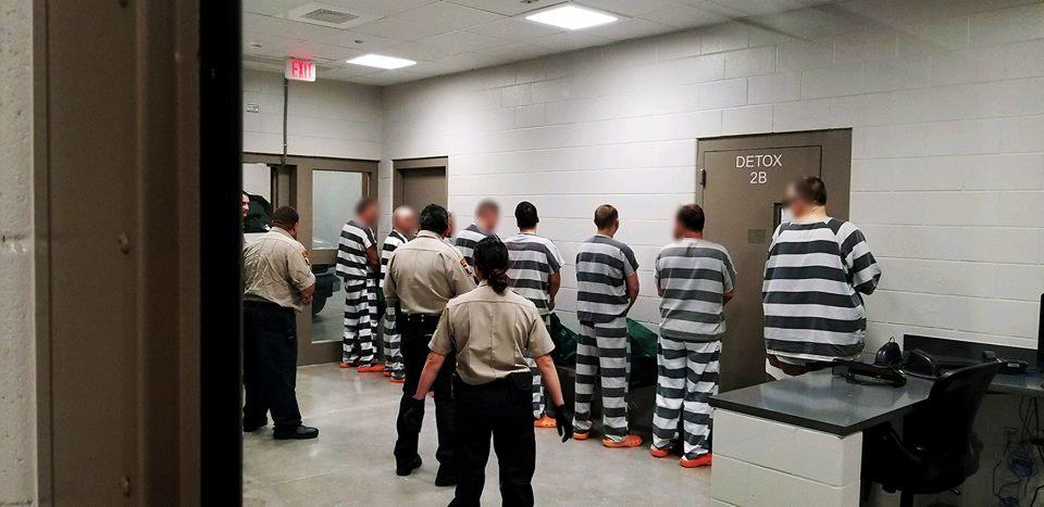 Inmates against the wall at new detention center 