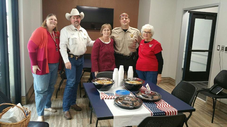 Ladies group with homemade pies with Officers 