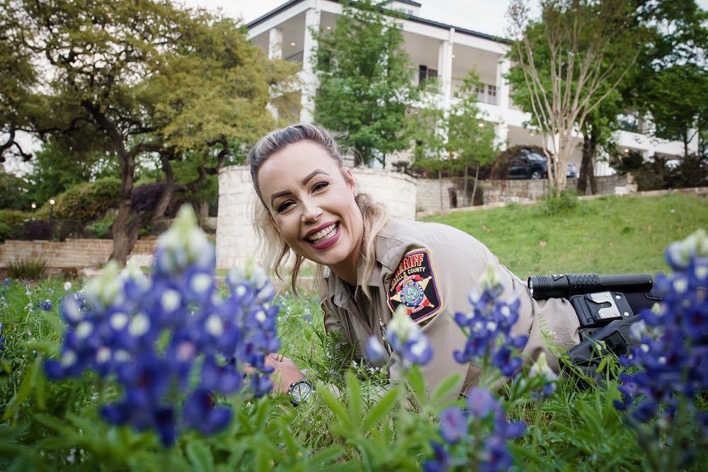 Female Officer resting in Bluebonnets 