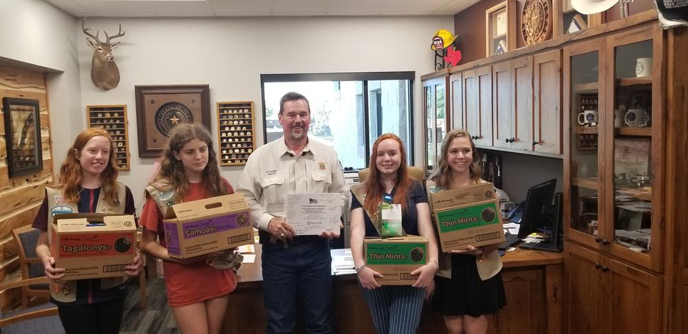 Girl Scouts delivering cookies to Police Department 