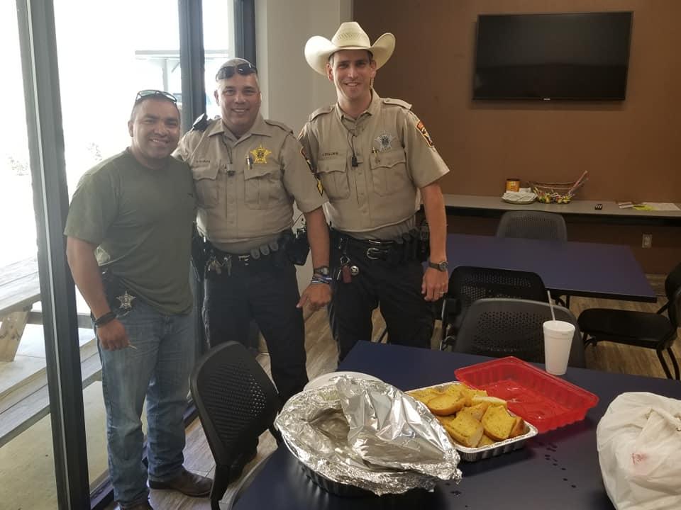 Officers eating lunch provided by community member 