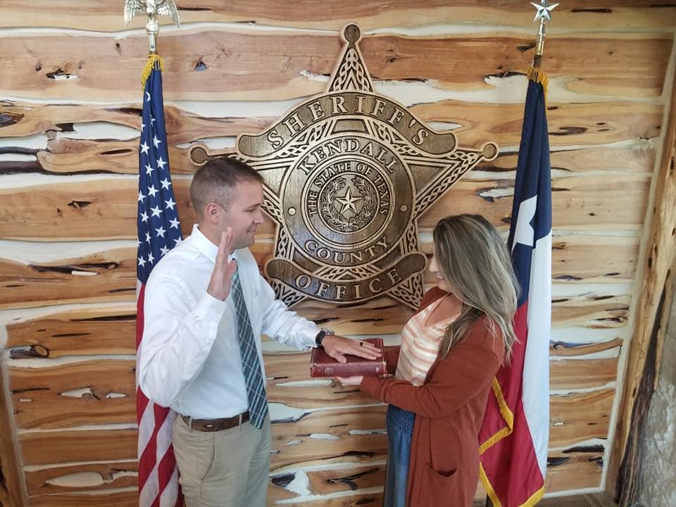 Male Deputy being sworn in to office 