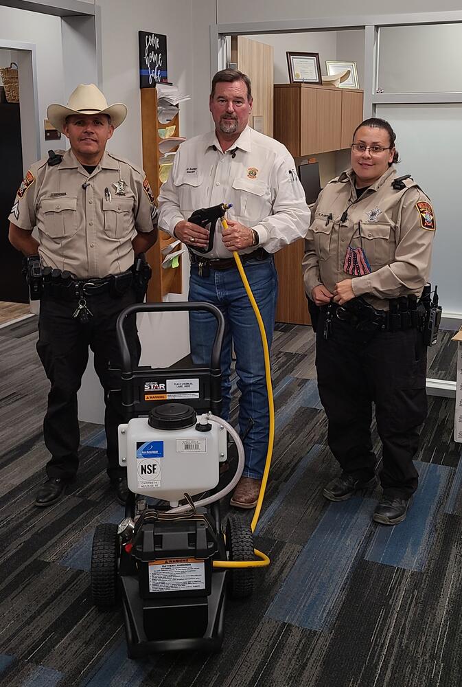 Sheriff and Deputies with the new Sanitation Sprayer
