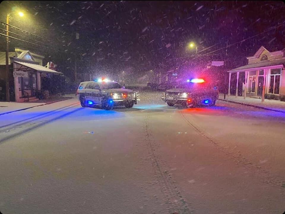 Patrol Unit in the Snow with lights on